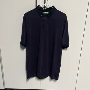 Travis Mathew size large polo. Purple with black collar.